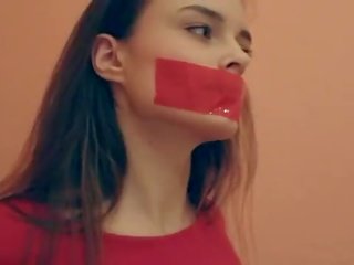 Brunet tape gagged & daňmak. who is she?